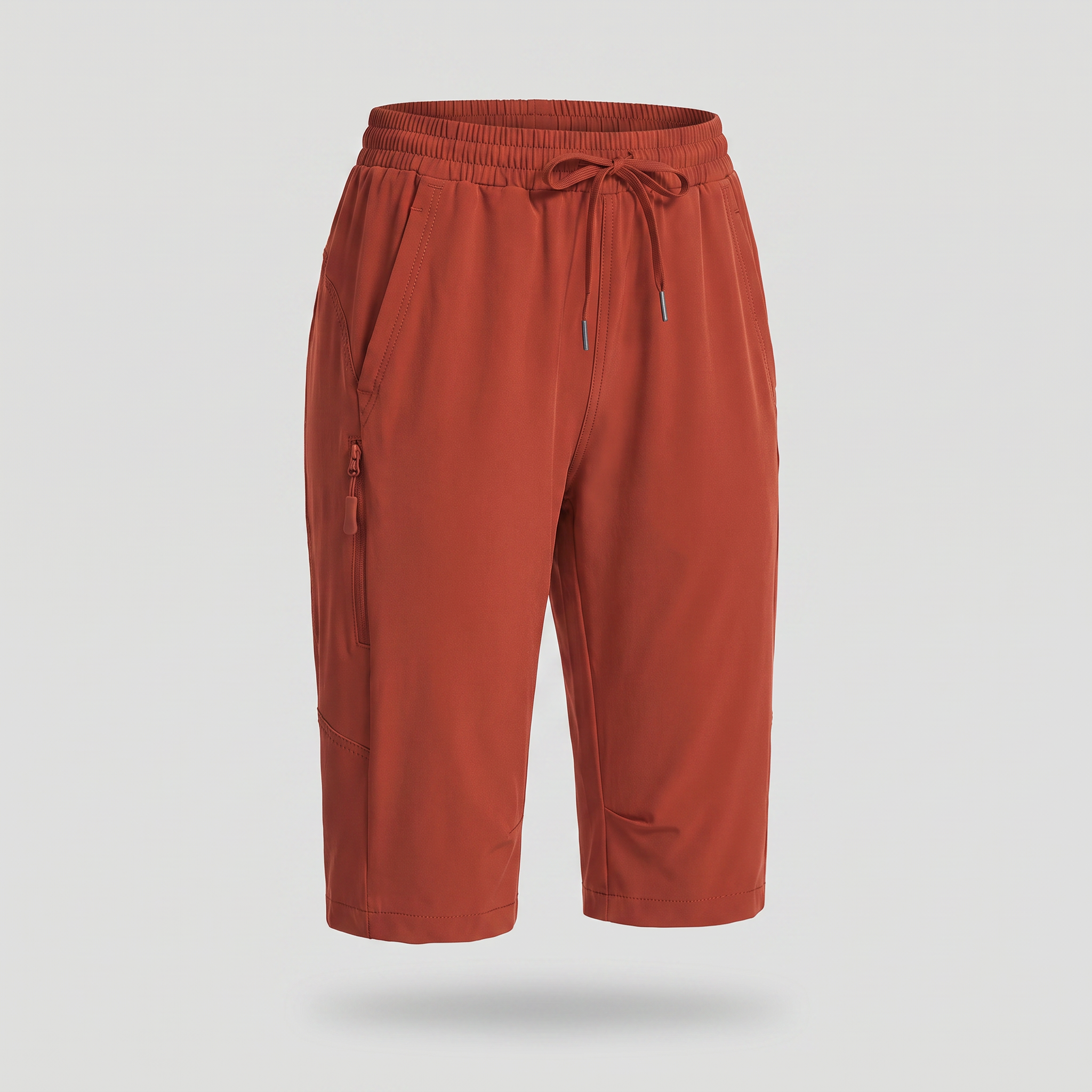 Women's knee-length hiking shorts in brick red, ghost mannequin front