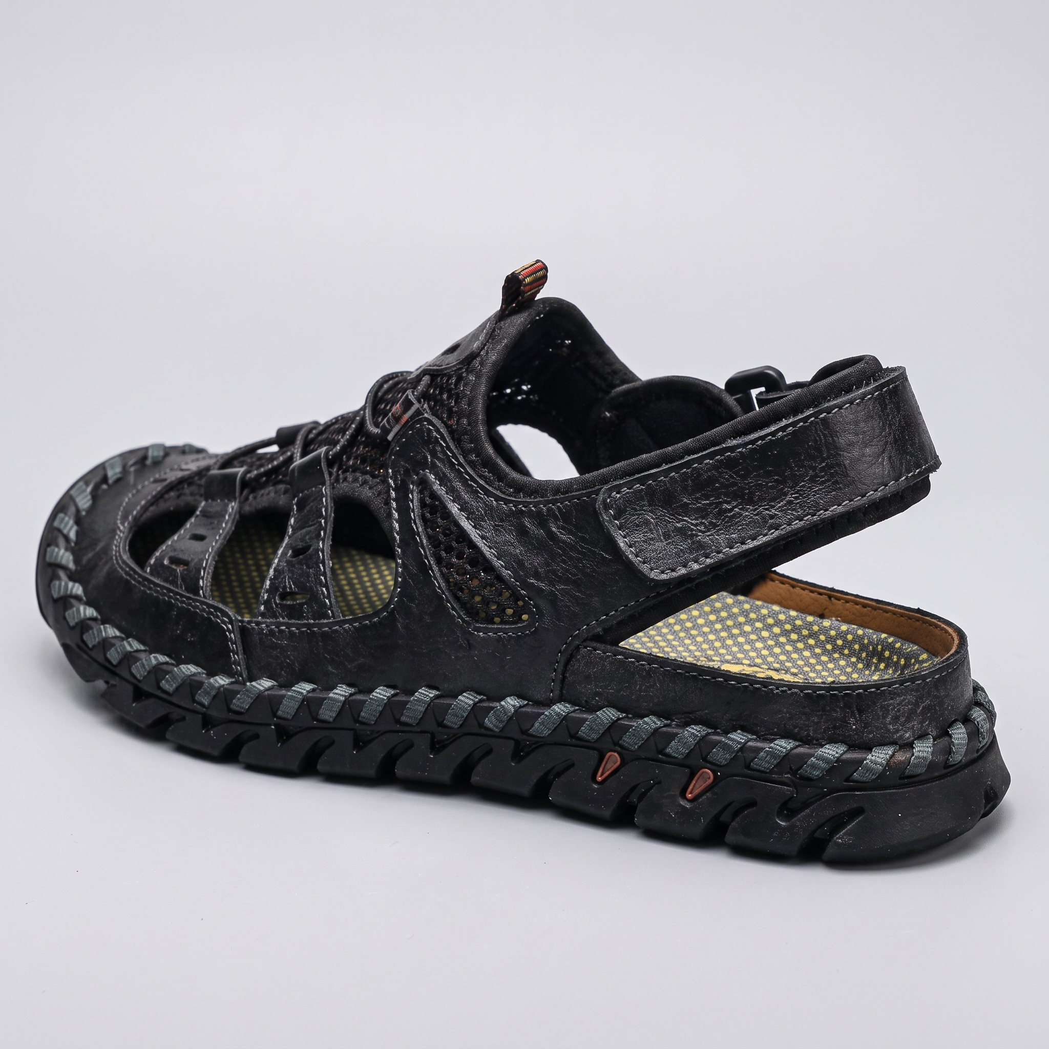 Rear view showing the open heel and adjustable ankle strap