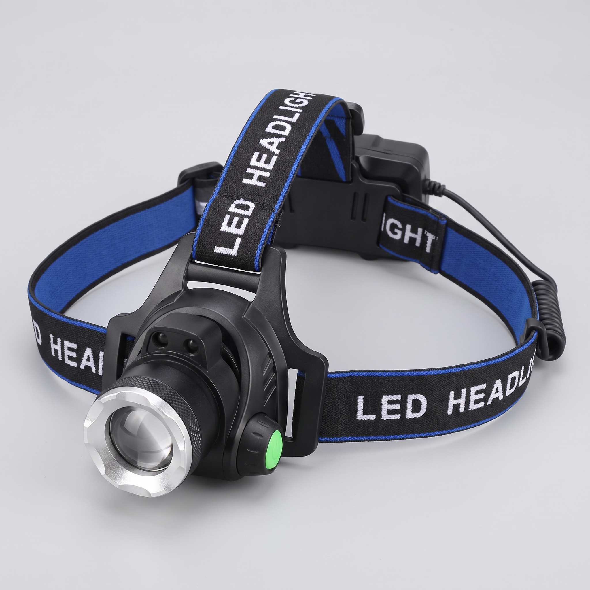 Rechargeable LED head torch, three-quarter view with harness