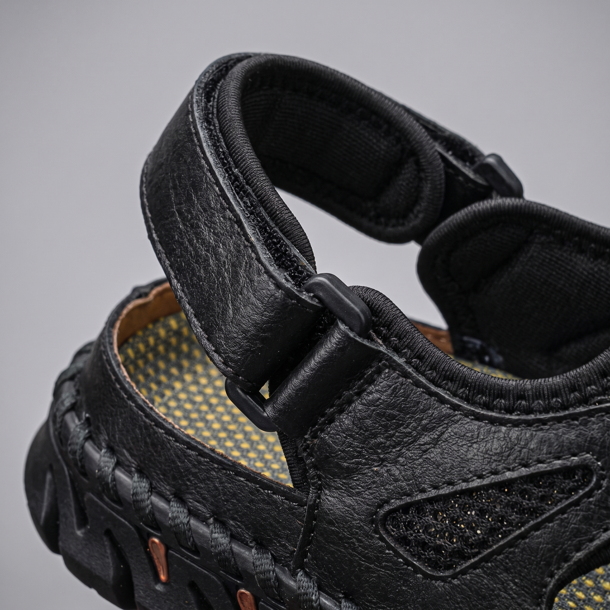 Close-up of the padded ankle strap and its adjustable slider